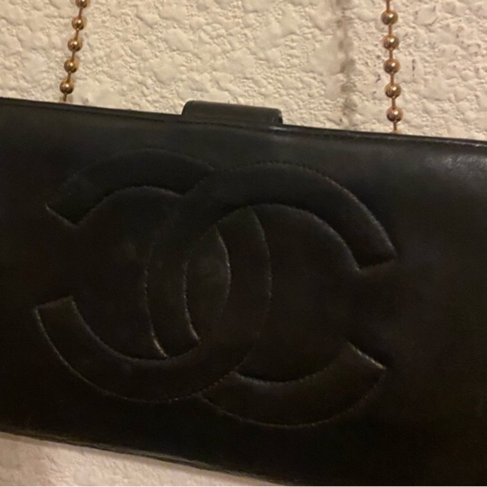 Lamb  authentic  Chanel with auth sticker . Going Chanel metal logo clasp .